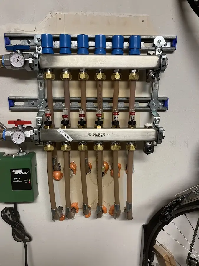 Plumber performing Water Heater Repair at a residential property in Raton